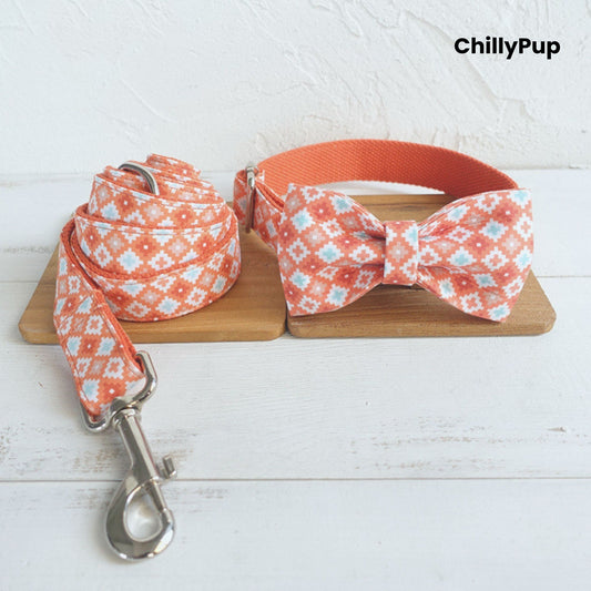 Dog collar, bow tie, and leash set with coral pattern on a wooden board, branded 'ChillyPup'.