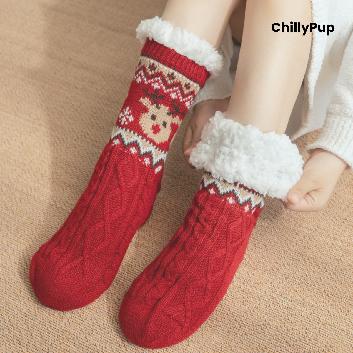 A pair of red knit crew socks with a white faux-fur cuff and a festive snowman pattern near the top, shown on a person's feet against a beige carpet background. The brand name 'ChillyPup' is visible in the top right corner.