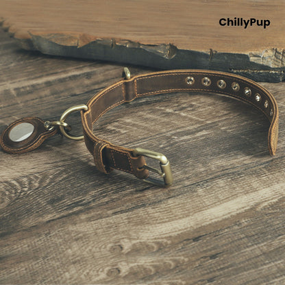 Brown leather dog collar with brass hardware on a wooden surface, branded 'ChillyPup'.
