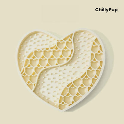 Heart-shaped purple dog lick mat with textured surface on a light gray background, branded 'ChillyPup'.