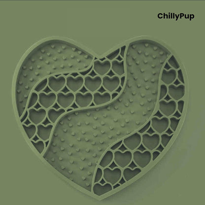 Heart-shaped purple dog lick mat with textured surface on a light gray background, branded 'ChillyPup'.