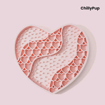 Heart-shaped purple dog lick mat with textured surface on a light gray background, branded 'ChillyPup'.
