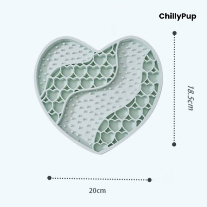 Heart-shaped purple dog lick mat with textured surface on a light gray background, branded 'ChillyPup'.