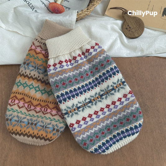 Knitted dog jumper with colourful pattern on a white surface, brand 'ChillyPup' visible.