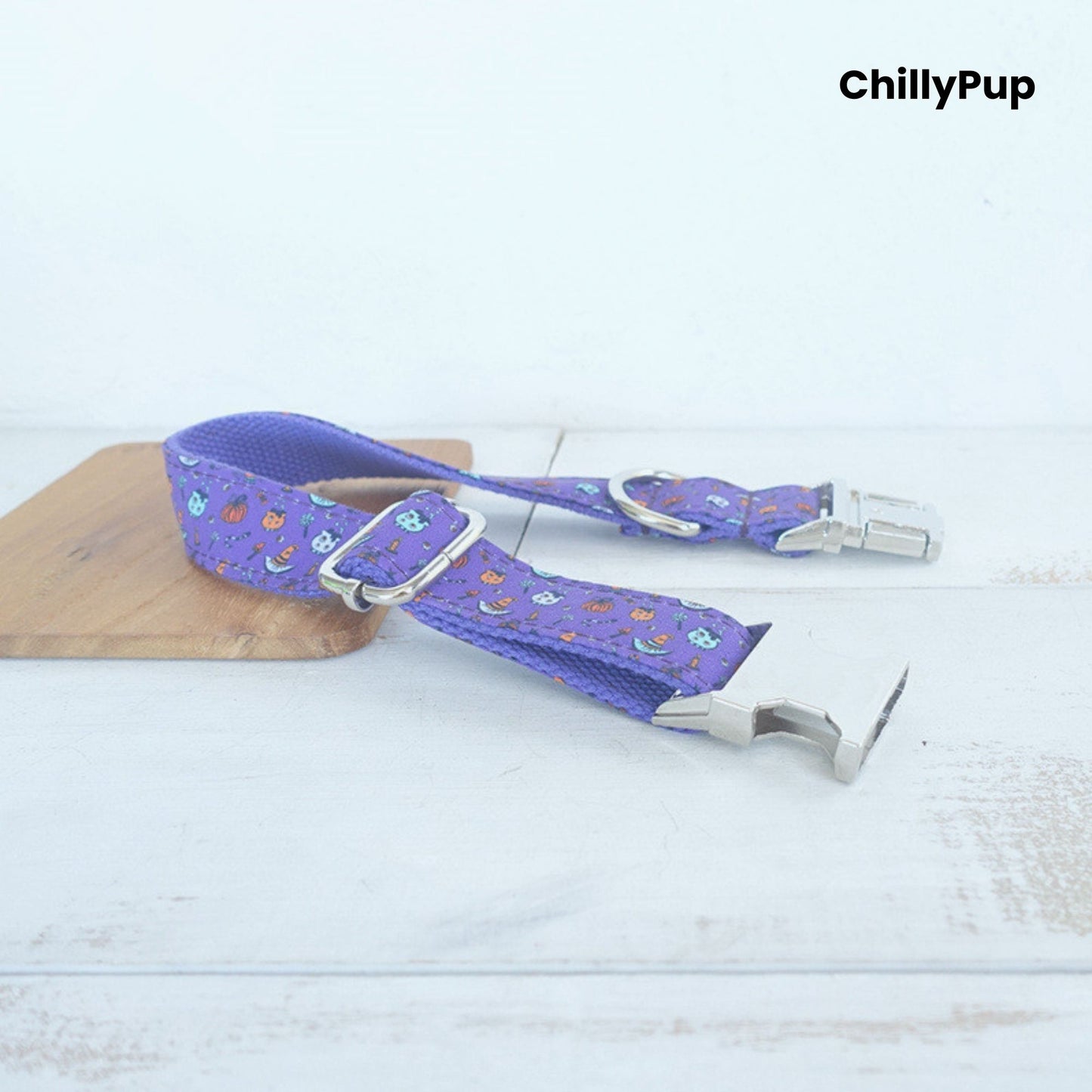 Purple Halloween dog collar on a wooden board, branded 'ChillyPup