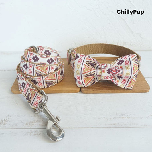 Dog collar with bow tie and lead set on a wooden board, branded 'ChillyPup'.