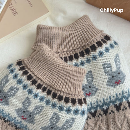 Knitted dog sweater with pattern on a wooden surface, branded 'ChillyPup'.
